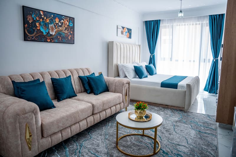 Sofa and king bed in the bright main room